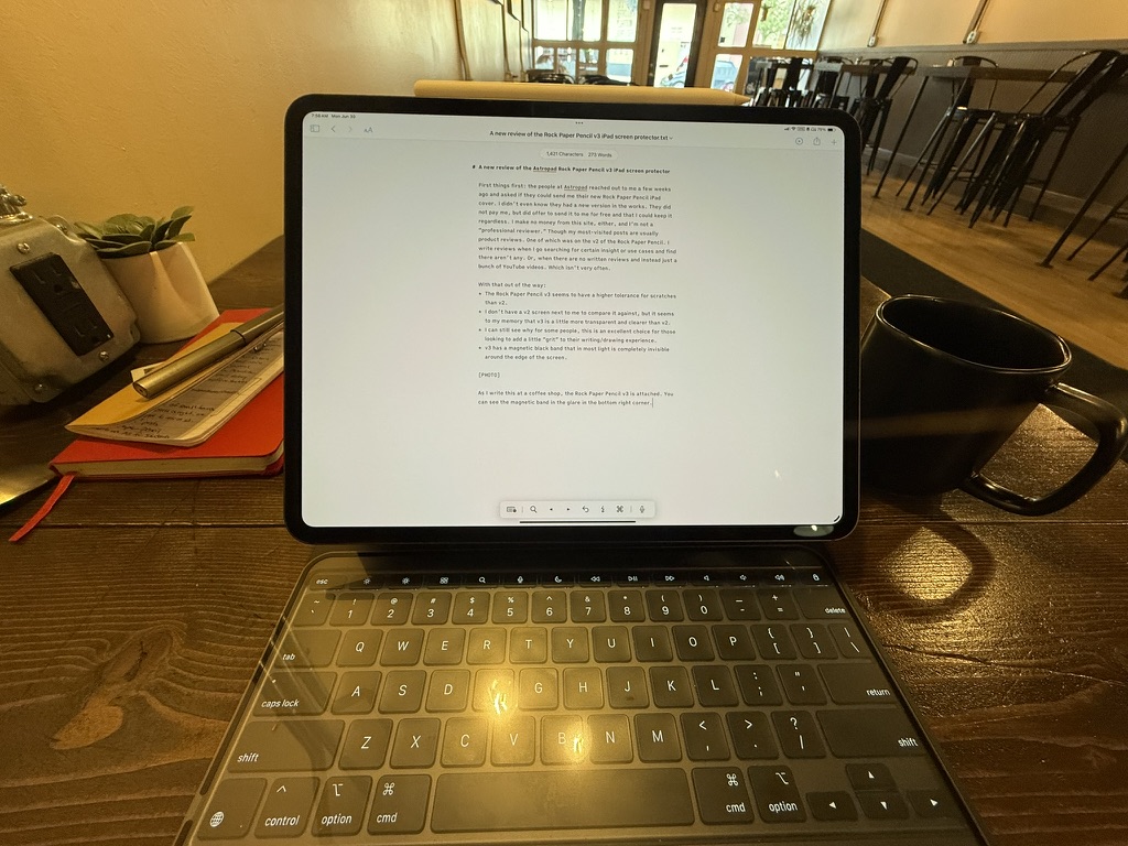The nanotexture iPad screen by itself. The screen protector is lying on the keyboard.